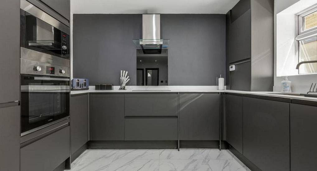 Sleek anthracite fitted kitchen at Diamond Tower, a luxury Blackpool hen party house sleeping large groups.