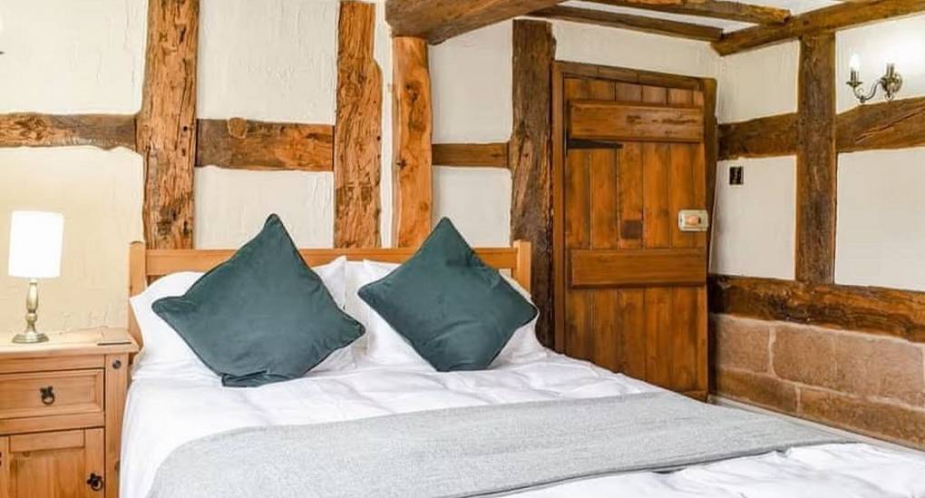 Double bedroom with open beams showing