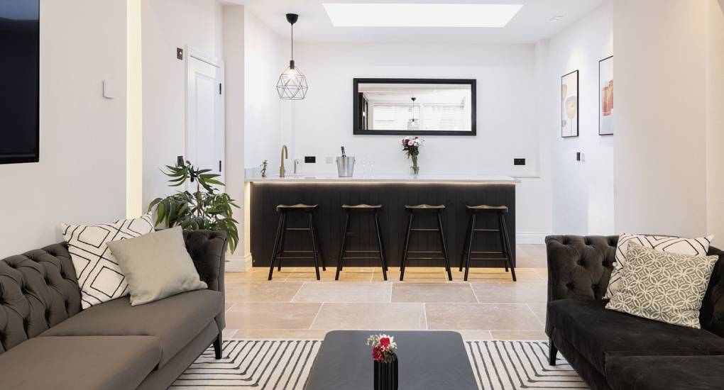 Cocktail bar area with stools in the luxury Skyline Hen House lounge